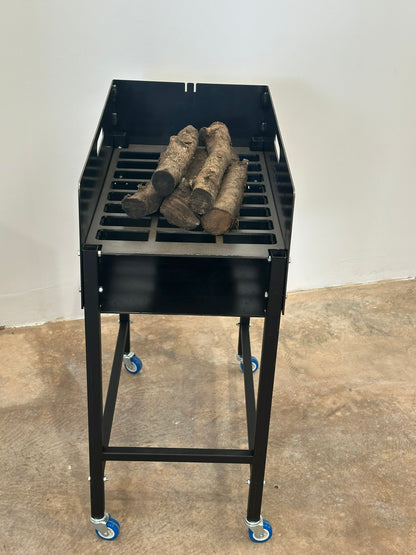 Brasero/Leñero Individual con ruedas + Asador Libro 50x35cm